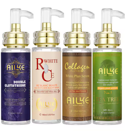 Four skincare serum bottles with different labels and colors on a white background